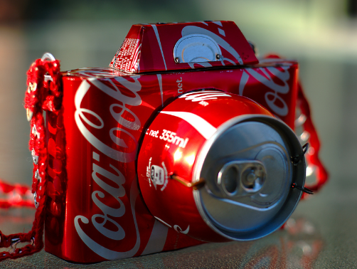 The 355ml/12oz 'standard' can doesn't exactly have the Paparazzi doorstopping it...(Picture Credit: Coke)