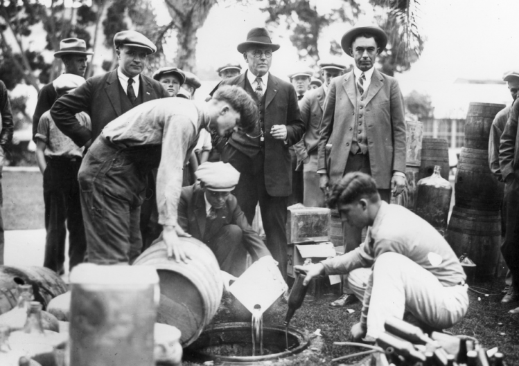 Sheriff dumping bootleg booze in Orange County, California during the age of prohibition (Photo: Orange County Archives)