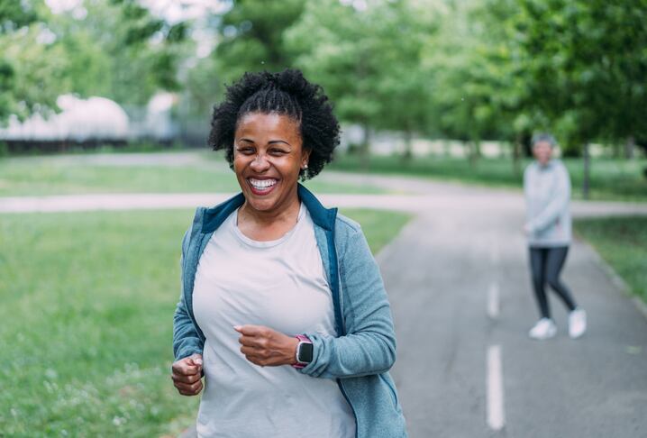 Shot of two women and doing jogging on the public park.