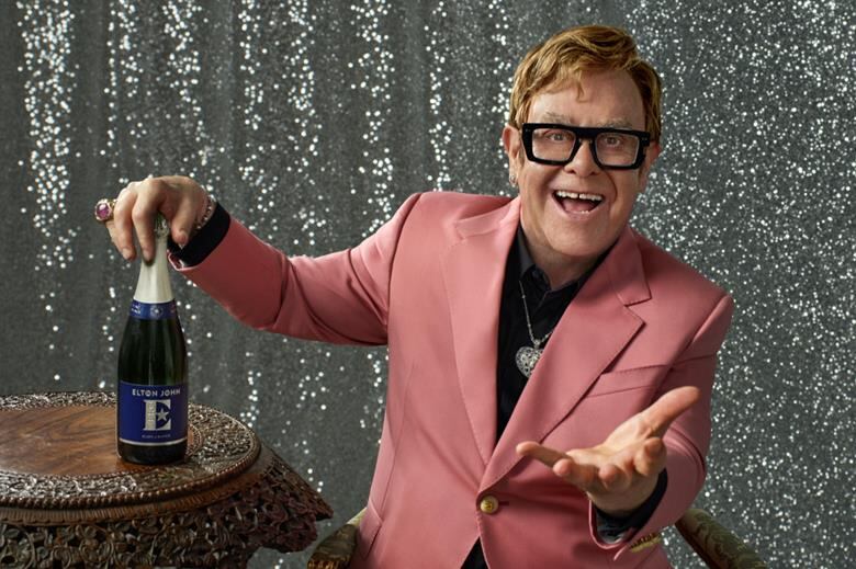 Bottle of Elton John Zero Blanc de Blancs with elegant branding.
