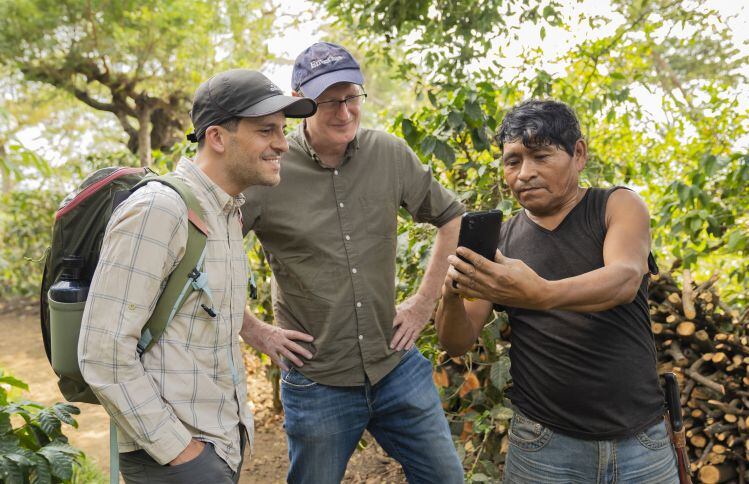 A-smallholder-farmer-in-Guatemala-shares-coffee-production-information-with-representatives-from-Peet-s-Coffee-and-Enveritas.jpg