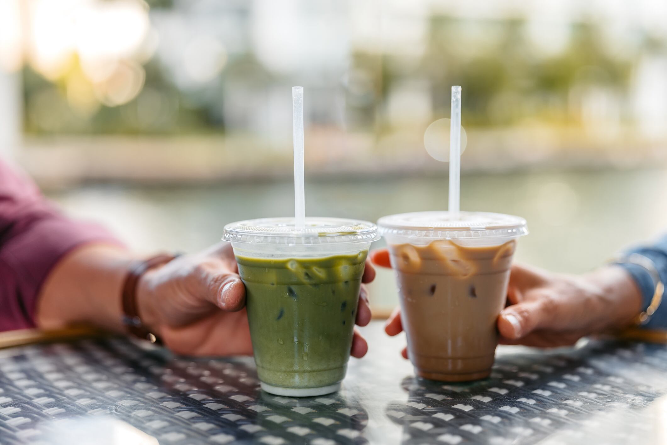 .Close-up of a mid-adult couple drinking coffee.