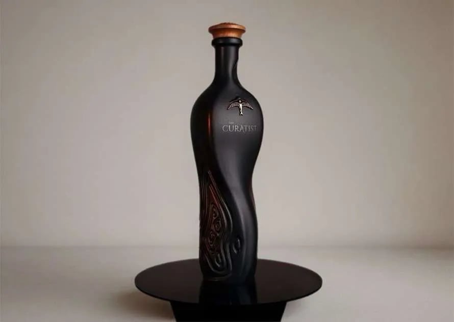 Black ceramic bottle of The Curatist Panama Edition with etched detailing.