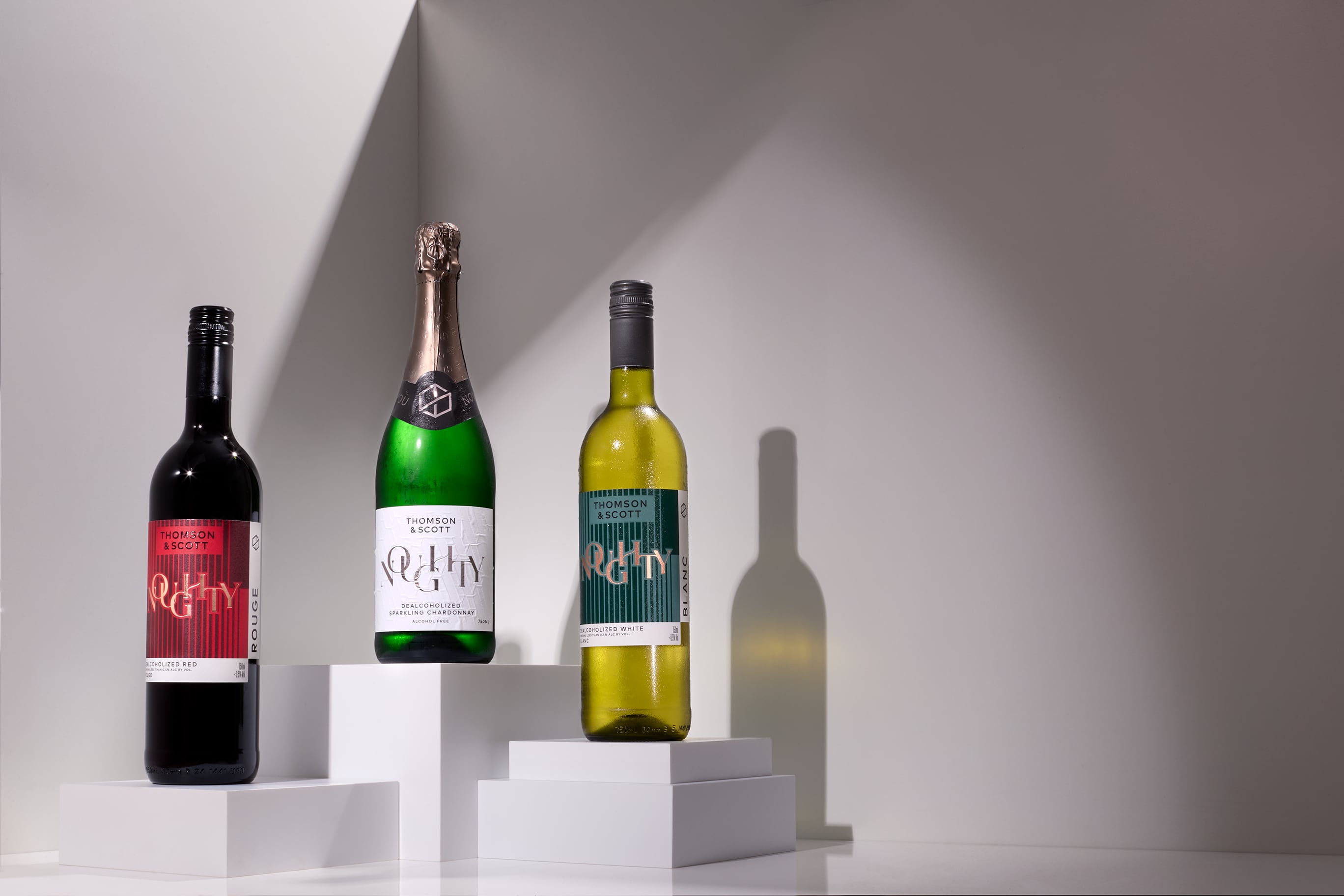 Noughty Sparkling Chardonnay alongside Noughty Rouge and Noughty Blanc.