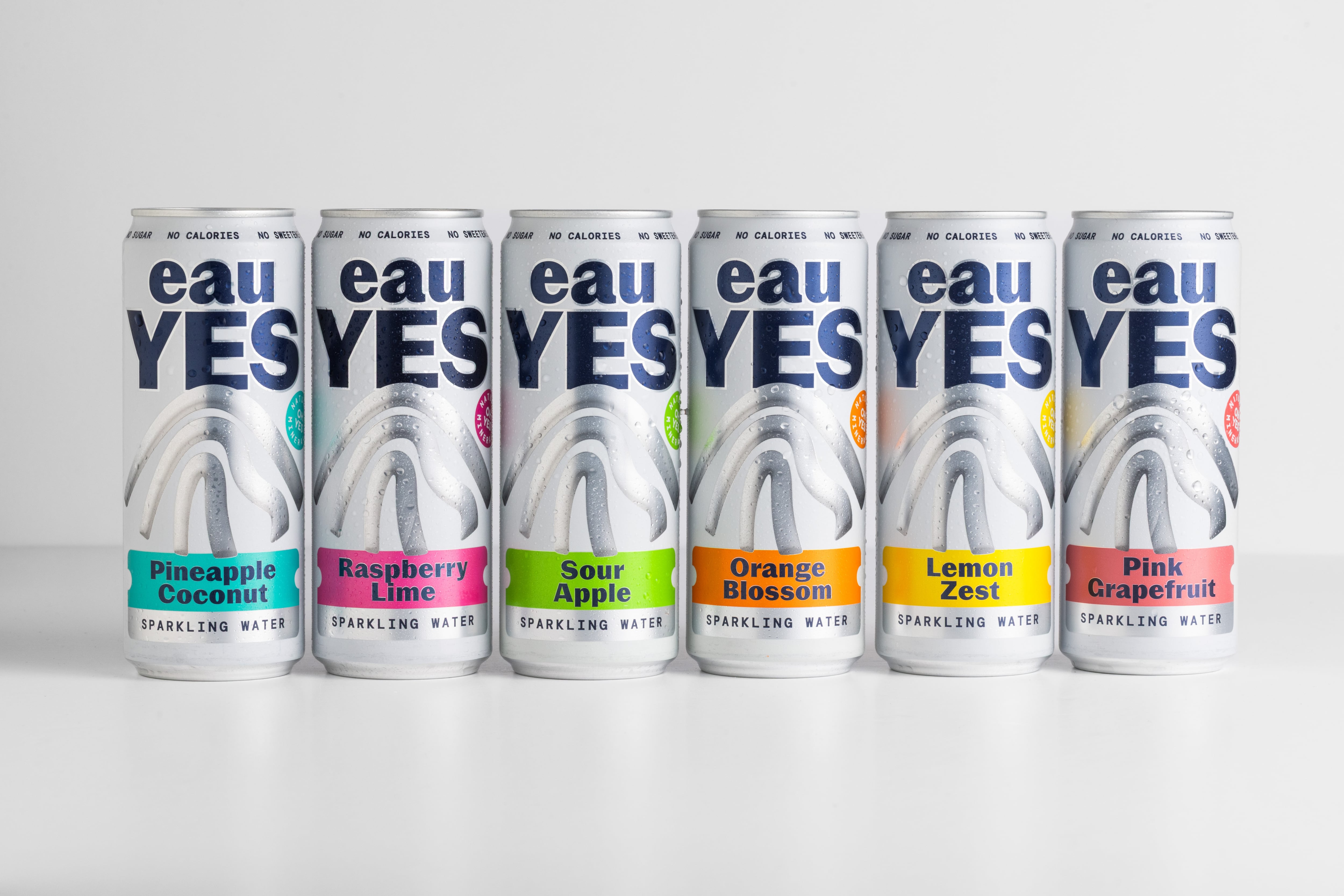 Selection of eauYES sparkling mineral water cans in multiple flavours.