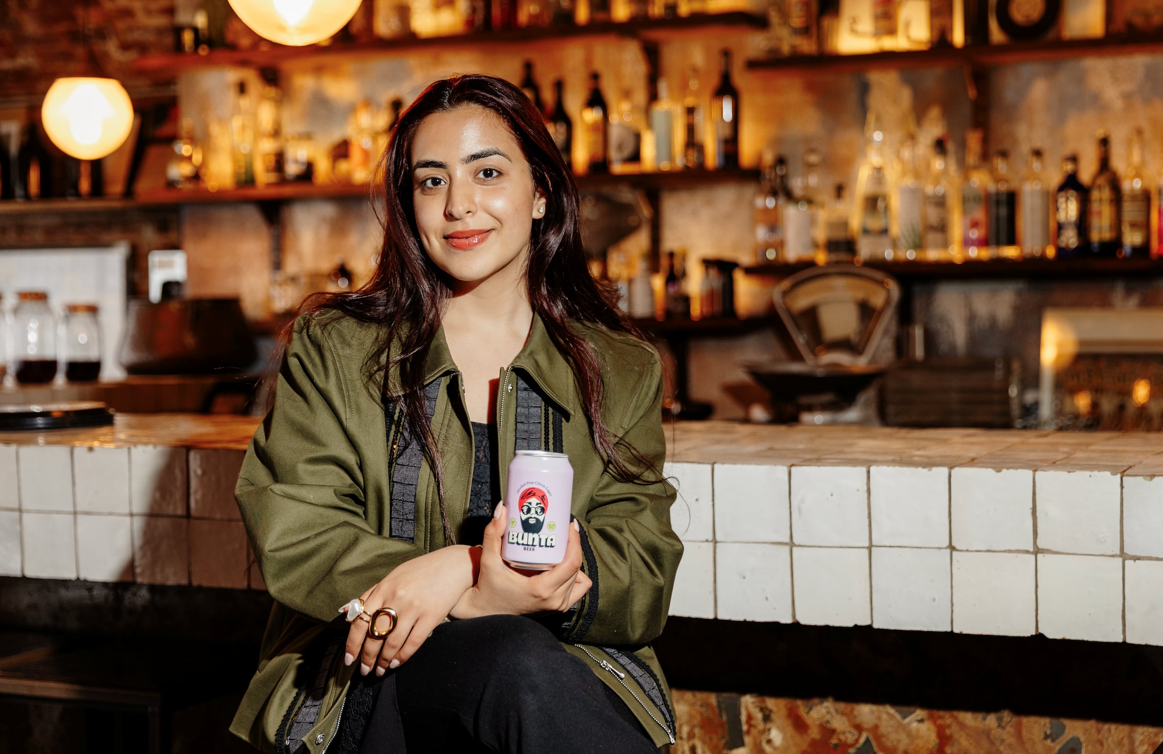 Bunta Beer pink can featuring illustrated character design.