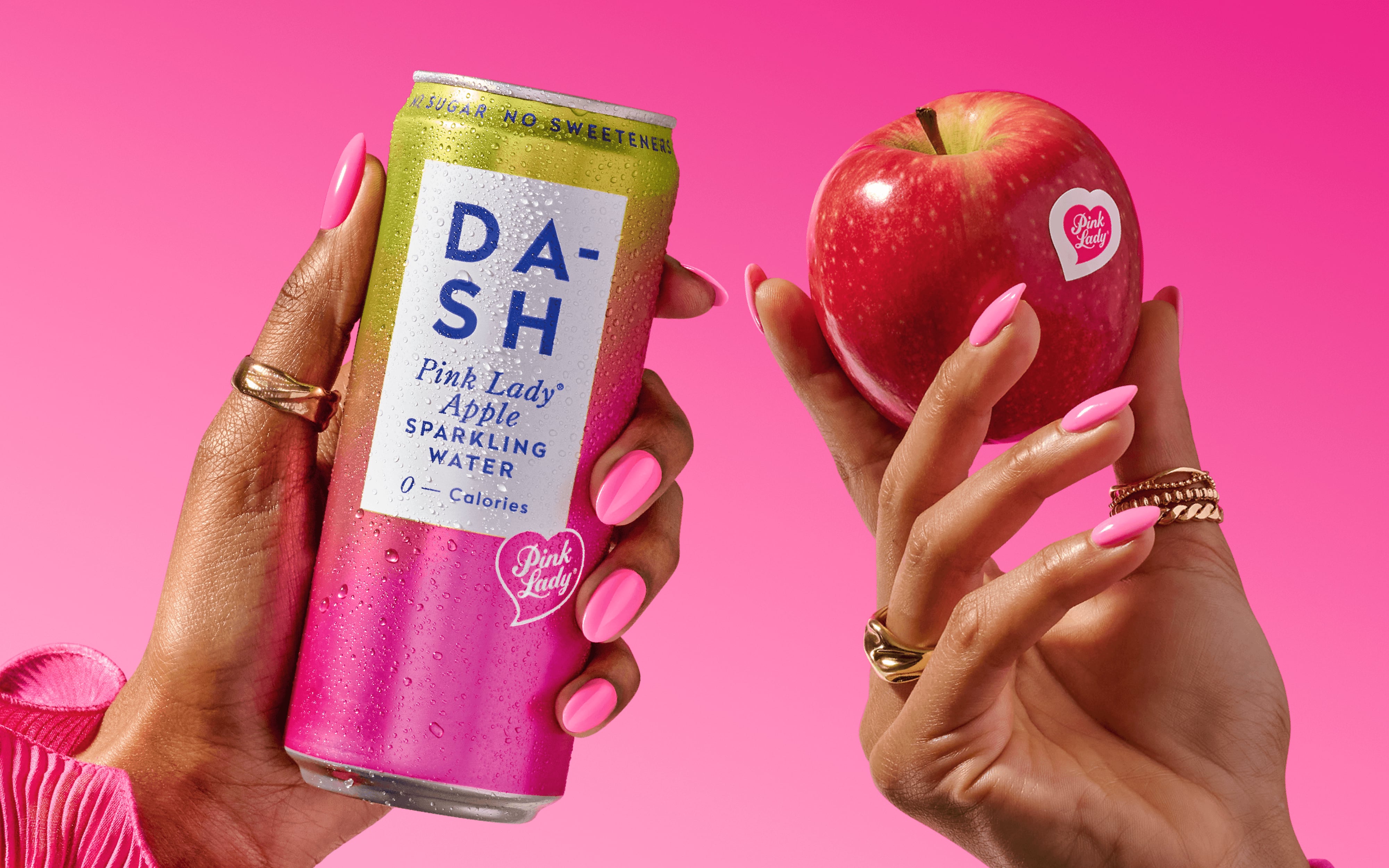 Sparkling water cans from DASH featuring apple-inspired branding.