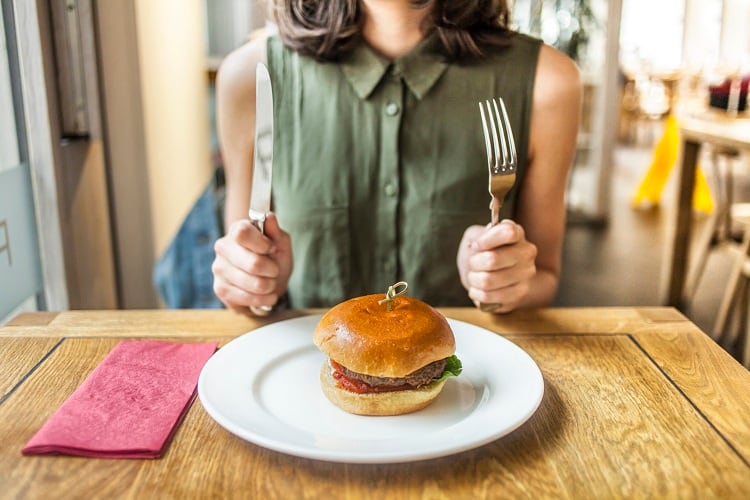Woman and hamburger