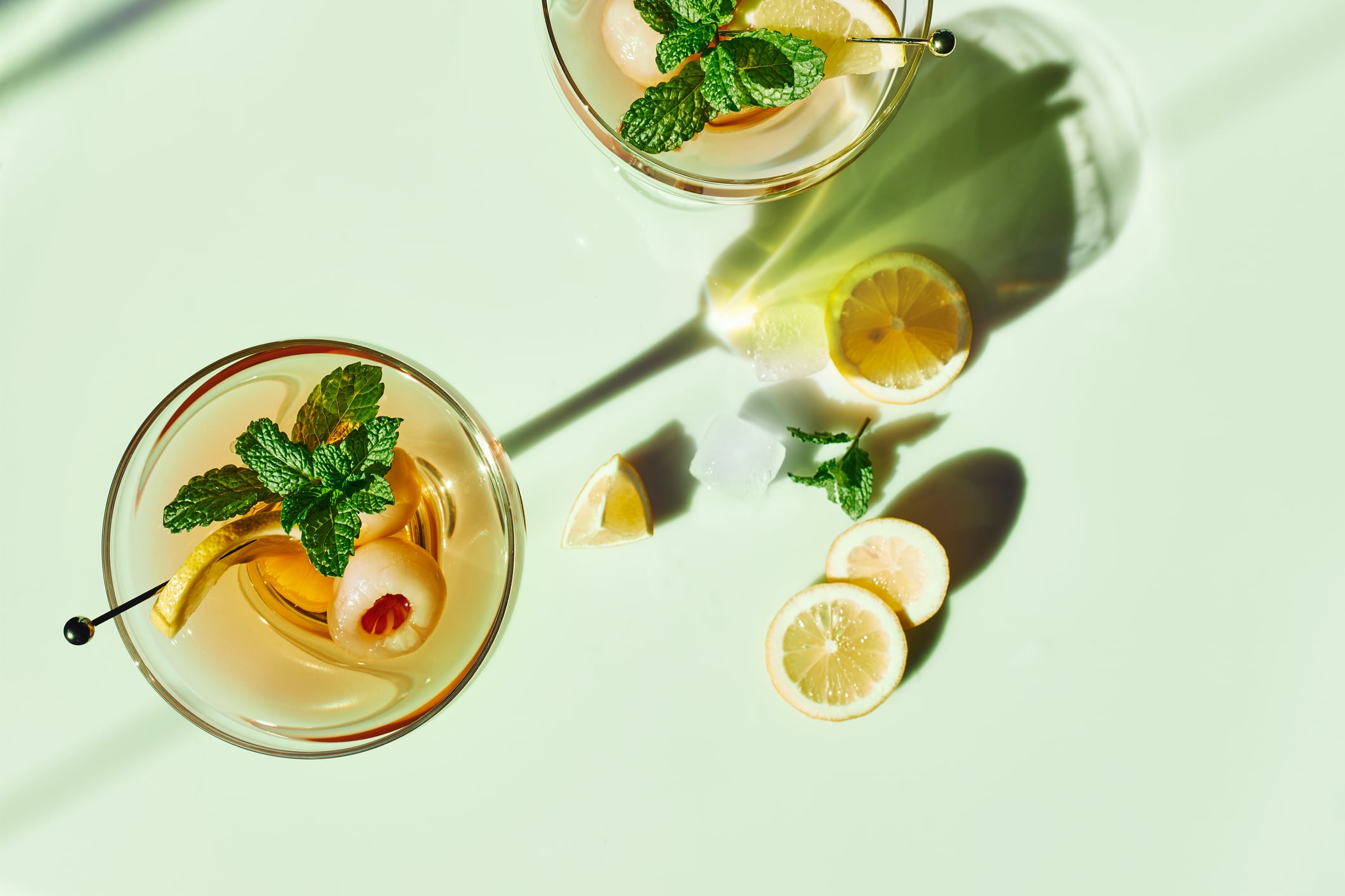 Refreshing lychee drink with lime, mint leaves and ice.