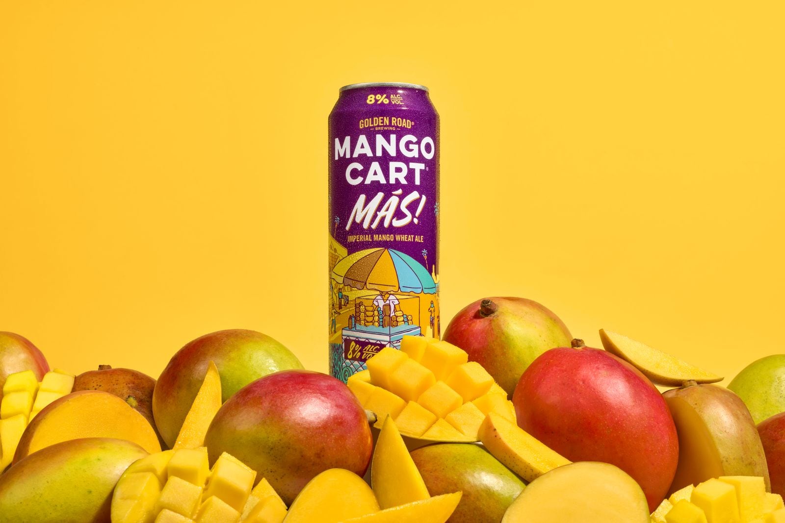 Can of Golden Road Más mango wheat ale on a bright backdrop.
