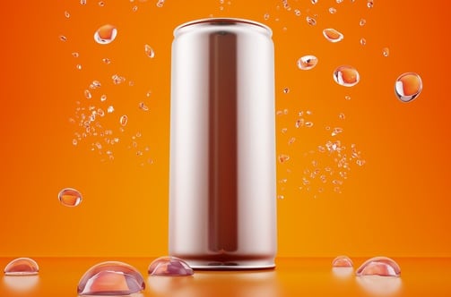 Metallic can, orange energy drink and splash of water