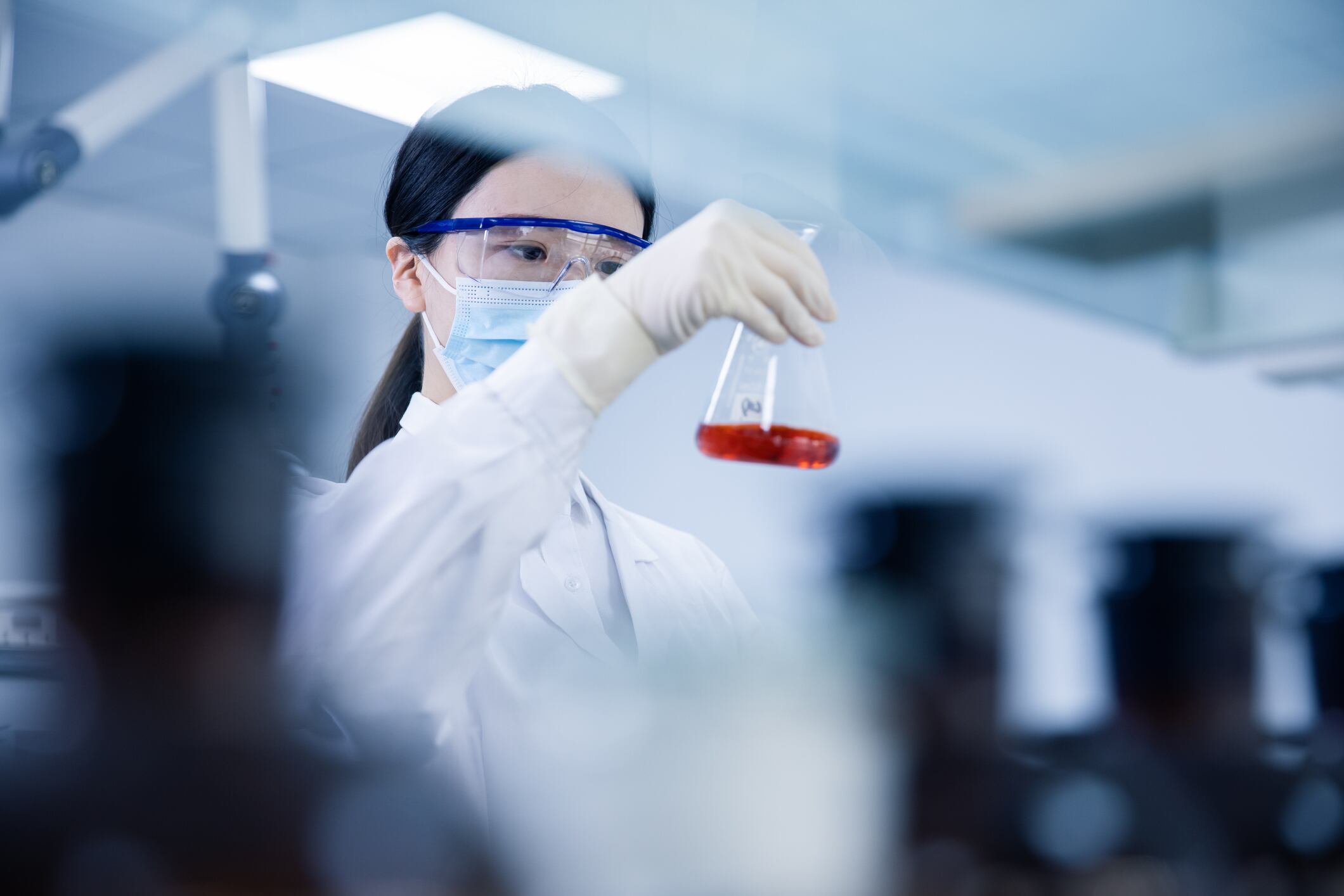 Asian female Scientist Working In Laboratory