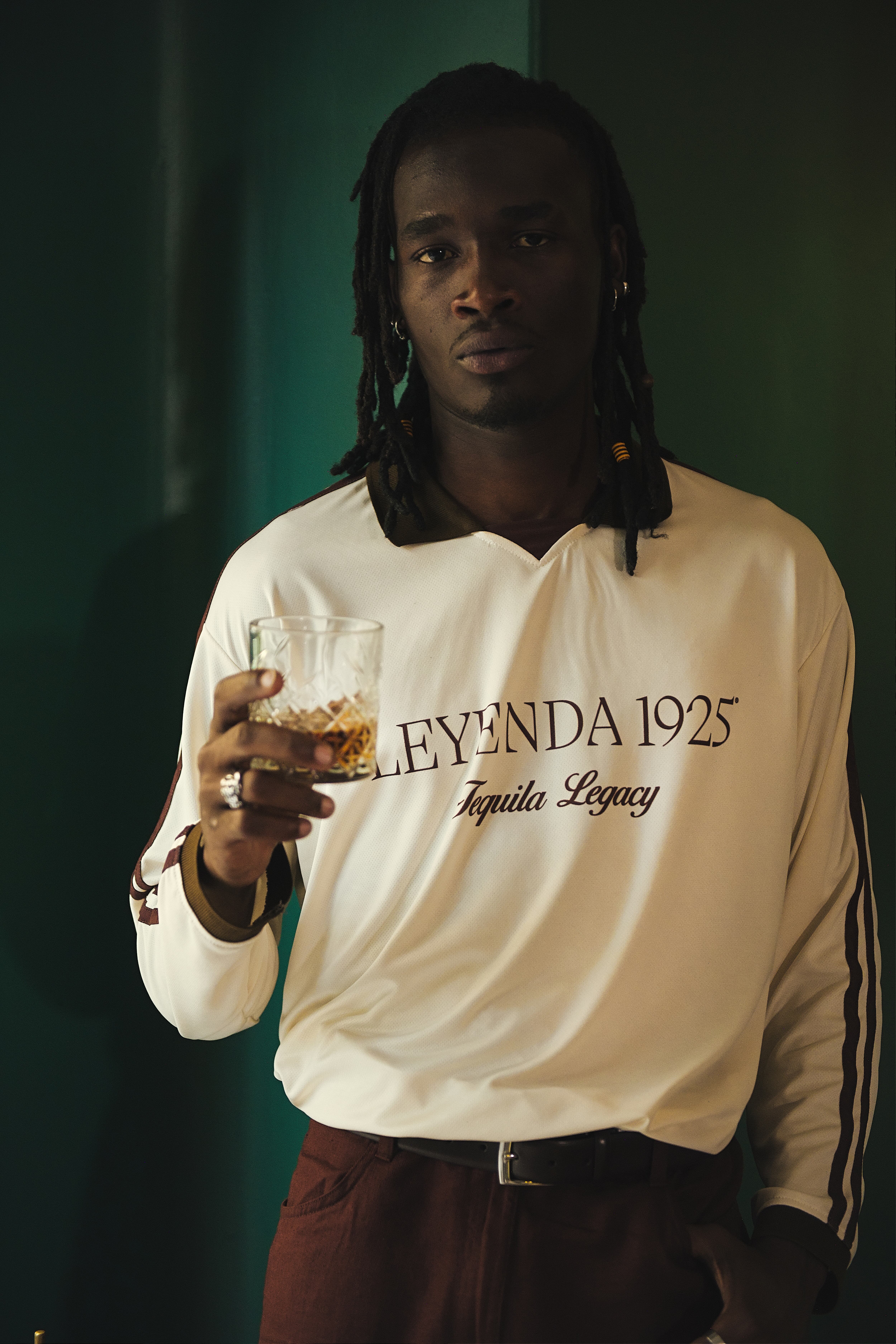 Luxury tequila bottle and branded merchandise from Leyenda 1925.