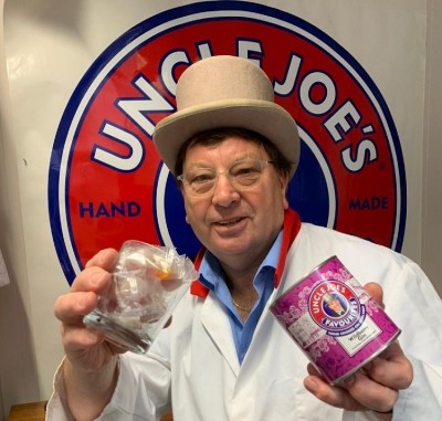 Joint MD John Winnard pours himself a glass of wildberry gin sweets. Pic: Uncle Joe's