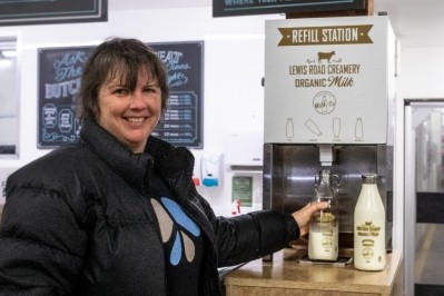 Auckland shopper Jenny Bramley was the first customer to fill her reusable glass bottle from the milk refillery station.
