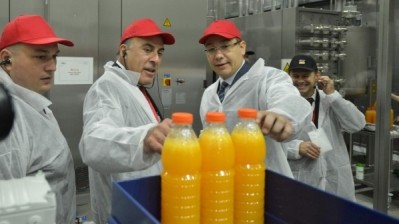 Muhtar Kent (center), CEO, The Coca-Cola Company with Romanian Prime Minister, Victor Ponta (L) and the Mayor of Ploiesti City, Iulian Badescu ( R ), at the opening of a bottling line for Cappy Pulpy Orange juice drink. Picture: Coca-Cola.