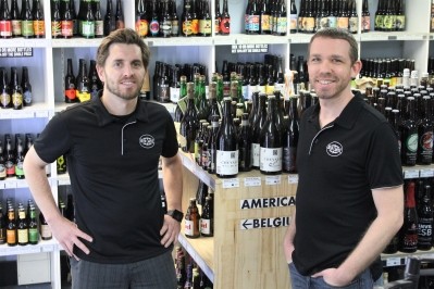 Beer Cartel's co-founders Richard Kelsey and Geoff Huens, with some of the 1,000 craft beers they offer.